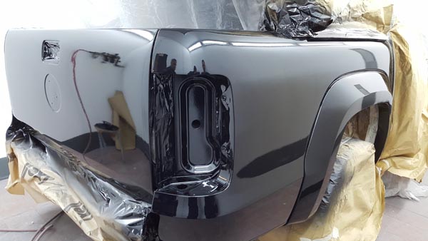 Pickup truck body panel resprayed in gloss grey