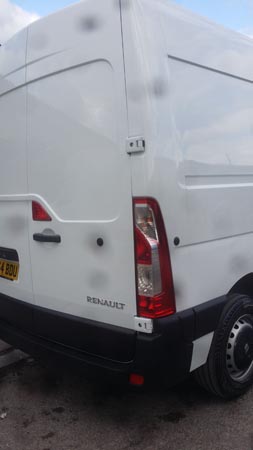 Tall white van after panel repair